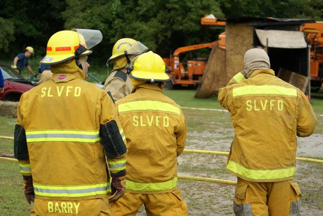 3 firefighters proudly displaying SLVFD insignia at vehicle fire training in Keeseville NY 8/21/2010